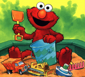Elmo likes to play in the sand, just like me